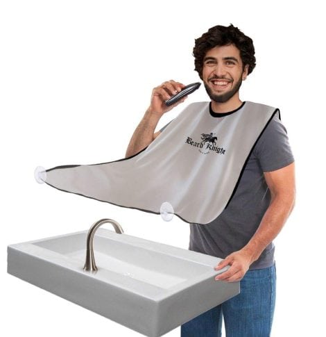 The Beard Knight Men’s Care Beard Apron is a non-stick white cape that catches hair clippings during shaving and trimming.