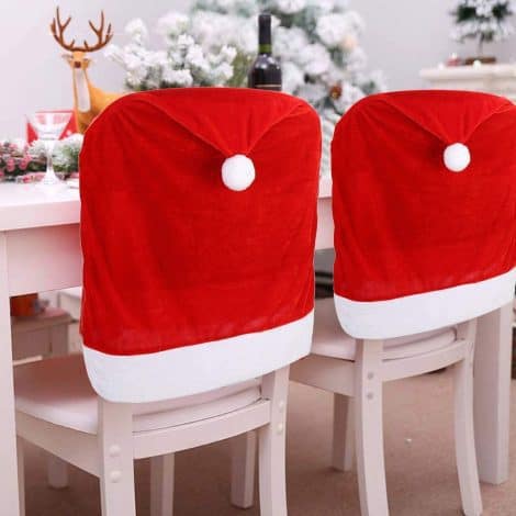 Set of 4 Festive Hat Dining Chair Slipcovers for Christmas, adding charm to your holiday decorations.