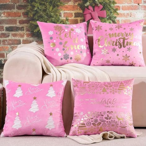 Get into the festive spirit with this set of 4 pink, gold, and white Christmas pillow covers.