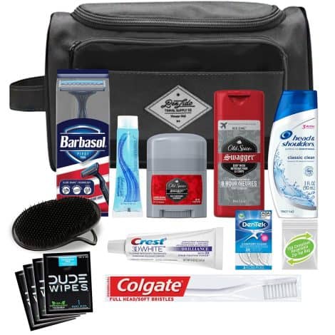 Convenient travel-sized men’s grooming kit including Head & Shoulders shampoo and scalp brush in a black bag.