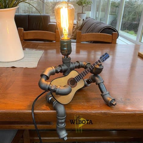 Steampunk-inspired Wibota Guitar Lamp, an artistic, retro-themed table decoration perfect for music lovers and guitar enthusiasts.