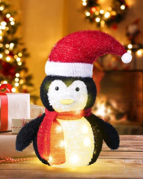 “Light up your holiday with the charming 1.8FT Pre-Lit Penguin Decorations featuring 50 Warm White LED lights.”