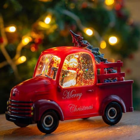 Light-up Christmas Snow Water Lantern featuring a Sparkling Snowman and Dog in a Red Truck. Perfect festive gift.