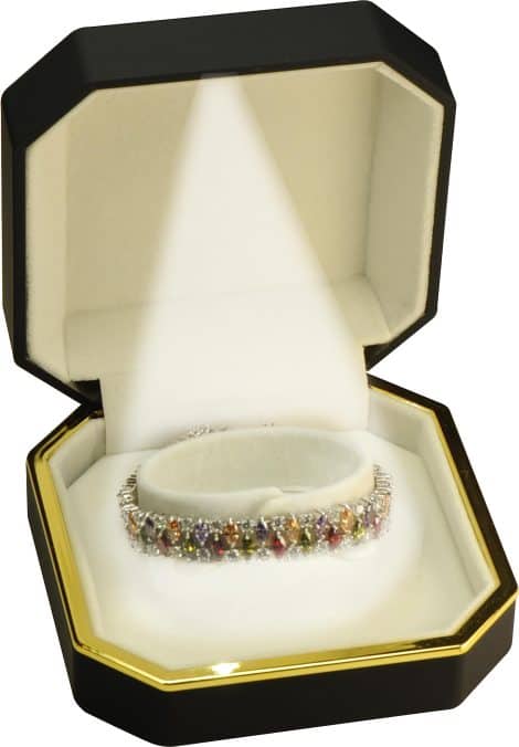 The LED Black Bangle Box is a luxurious, octagonal jewelry holder with gold trim, perfect for engagement and wedding gifts.