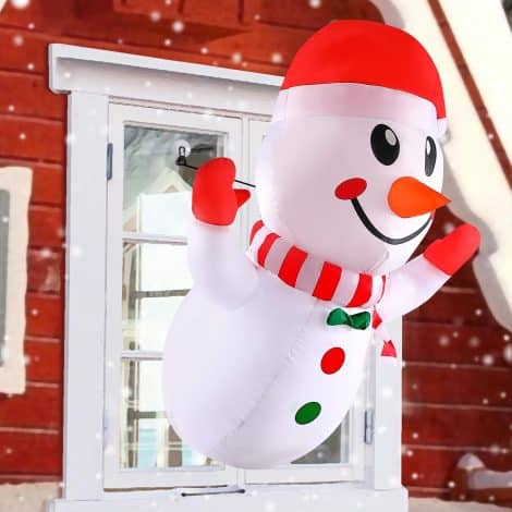 “4ft LED Christmas Inflatable Snowman: Perfect outdoor/indoor decoration, inflates easily for a festive yard or window!”