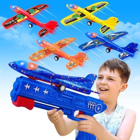 Set of 4 Foam Glider Catapult Planes with LED lights, perfect for outdoor play and birthdays.