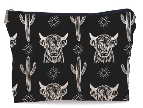 Cowgirl Chic Western Black Makeup Bag – A stylish cow-print accessory for the trendy American woman.