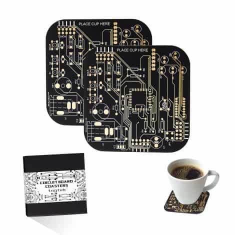 Black circuit board drink coasters with gold accents, perfect for coffee tables, bars, or as a gift.