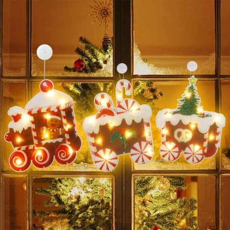 Christmas-themed hanging lights for windows, featuring a gingerbread man train, battery-powered, perfect for festive window displays. (36″x15″)