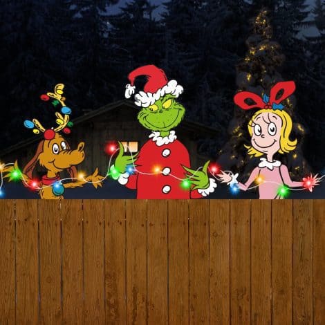 Illuminate your yard with the 3-Piece Grinch Fence Peeker, featuring LED lights and Whoville-inspired Christmas decor.