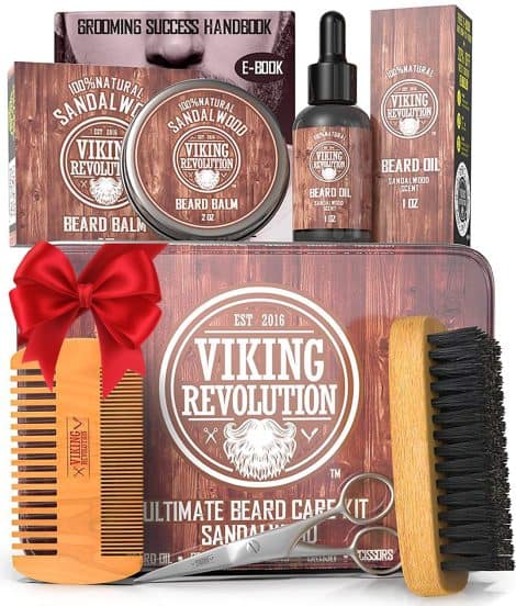 The Ultimate Men’s Beard Grooming Kit by Viking Revolution includes a boar beard brush, wooden comb, sandalwood balm, oil, and mustache scissors.