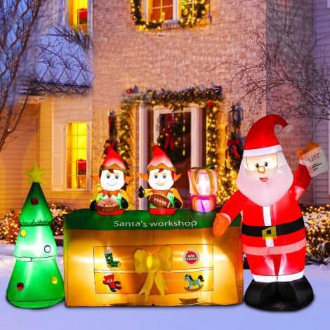 9 foot long Christmas blow-up yard decorations featuring Santa’s Shop with 2 elves and a Christmas tree. Perfect for home, parties, and the lawn during the holidays.