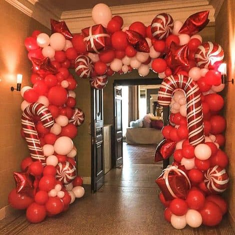 Christmas Balloon Garland Arch kit with 144 Pieces of Candy Balloons, Red Star Balloons, and Gift Box. Perfect for Christmas party decorations.