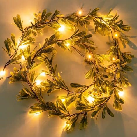 Light up your home with the Ethlomoer 6.6FT Christmas garland, adorned with snowflakes, perfect for your festivities.