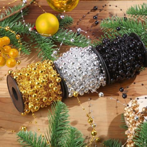 Christmas tree bead garland in black, gold, and silver for festive decoration of your tree or gifts.