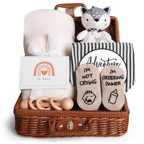 Unique baby gift set for newborn boys and girls, featuring a lovey blanket, bibs, socks, wooden rattle, and greeting card.