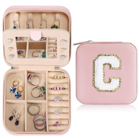 Travel jewelry organizer perfect for ladies on the go, conveniently storing necklaces, earrings, and rings. Ideal travel gift.