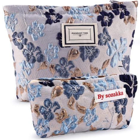 Travel in style with this adorable set of 2 floral makeup bags in gray and blue.